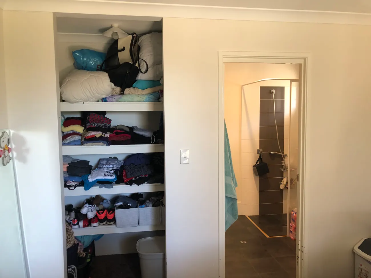Before: the original narrow bathroom doorway in a Perth home, too tight for a walking frame or wheelchair to pass